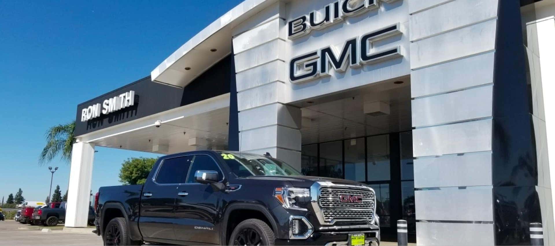 truck parked in front of dealership