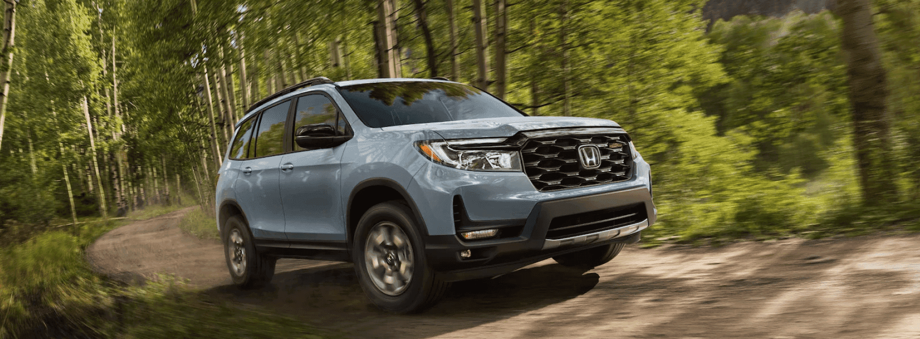 Honda SUV driving in the forest