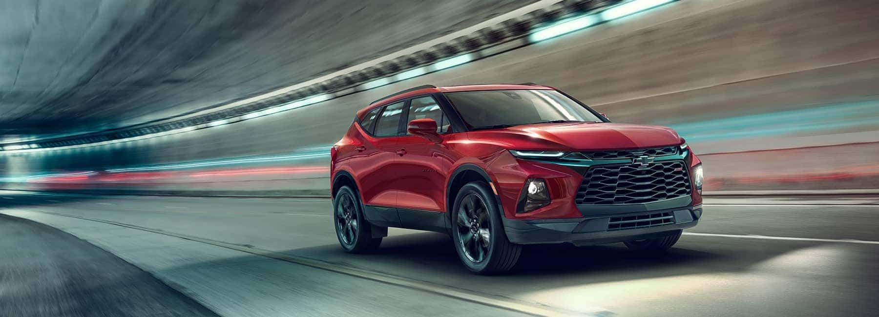 Red 2020 Blazer Driving Through a Tunnel