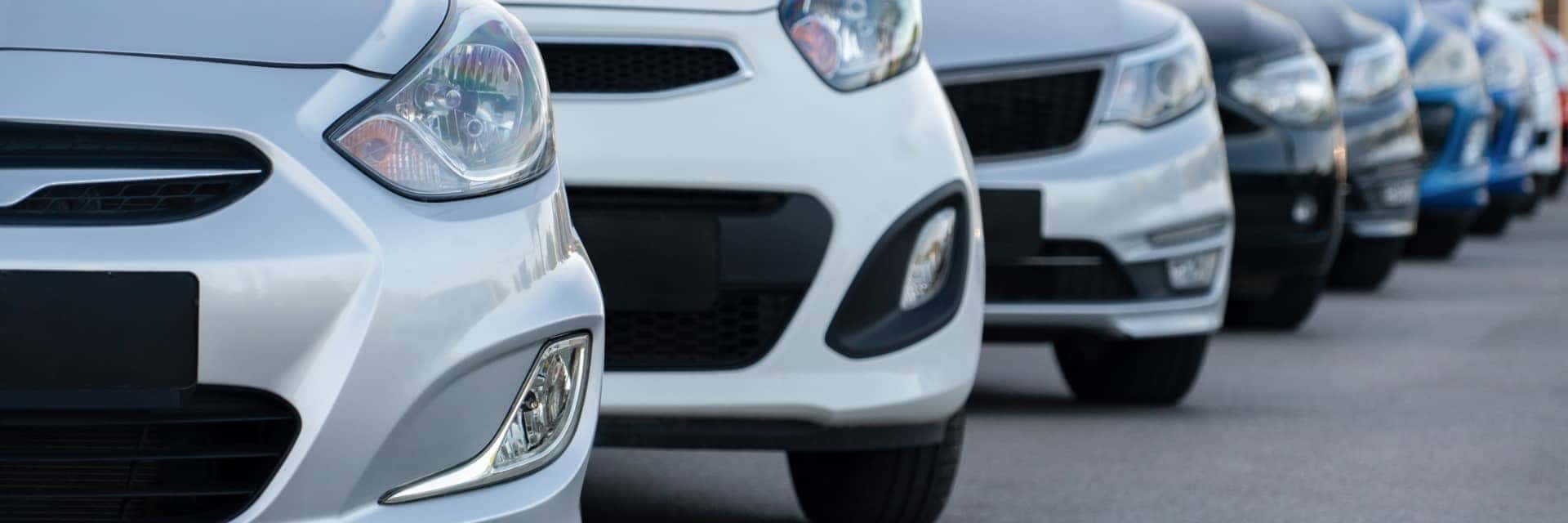 Front view of vehicle noses parked in a lot