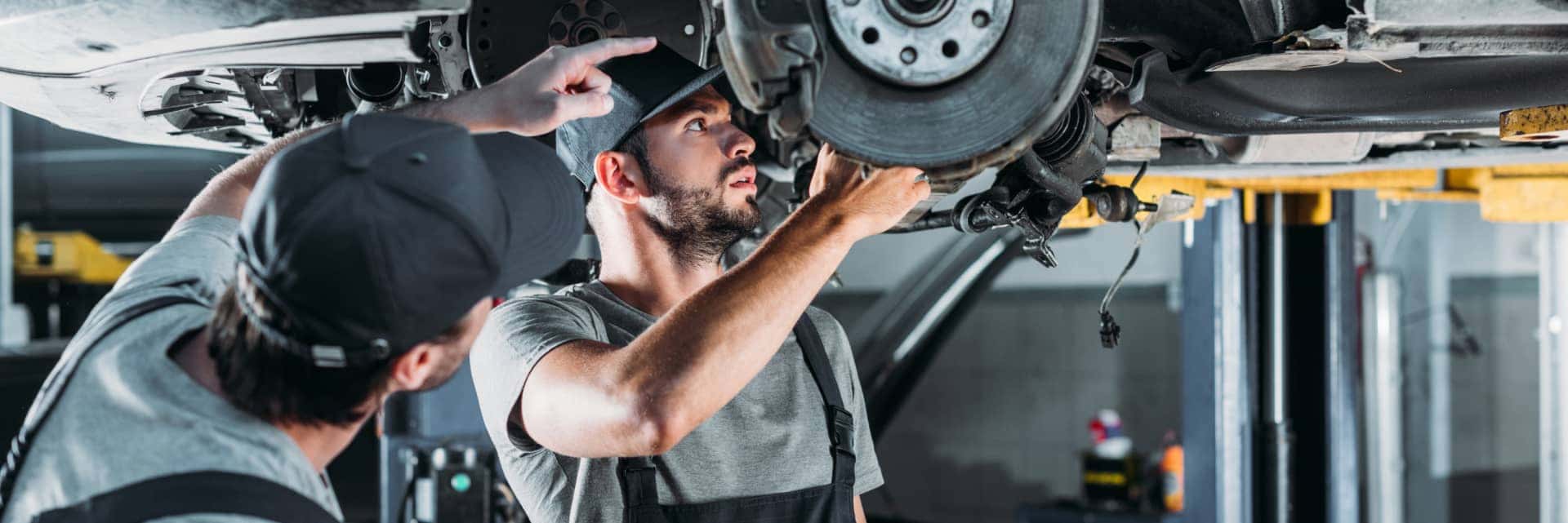 Service Technicians working on a car