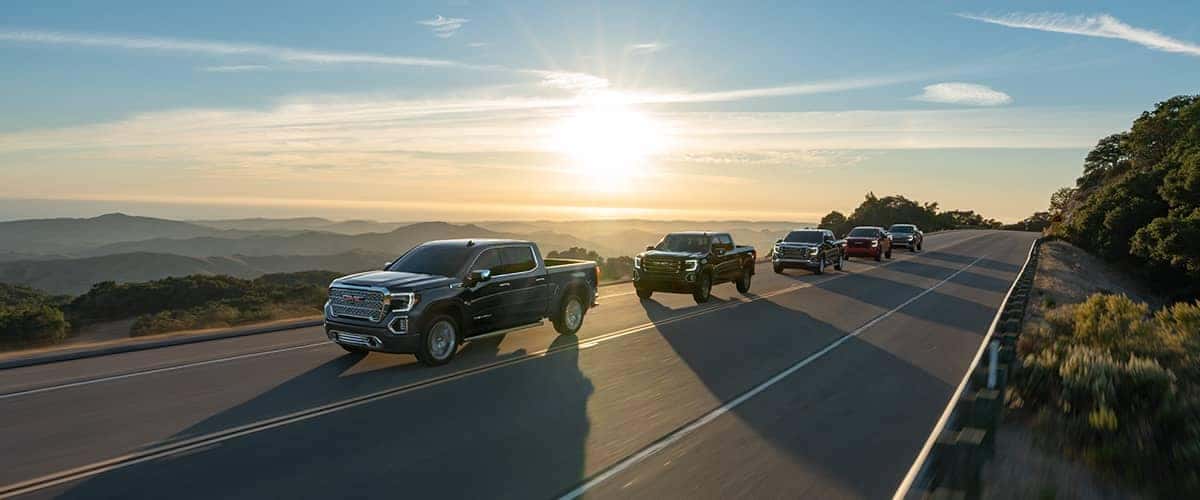 GMC Truck Lineup driving down the road