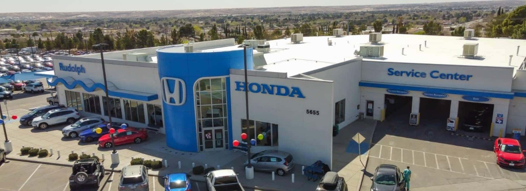 An exterior shot of a Honda dealership from aerial view