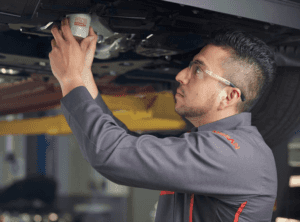 Nissan mechanic changing oil