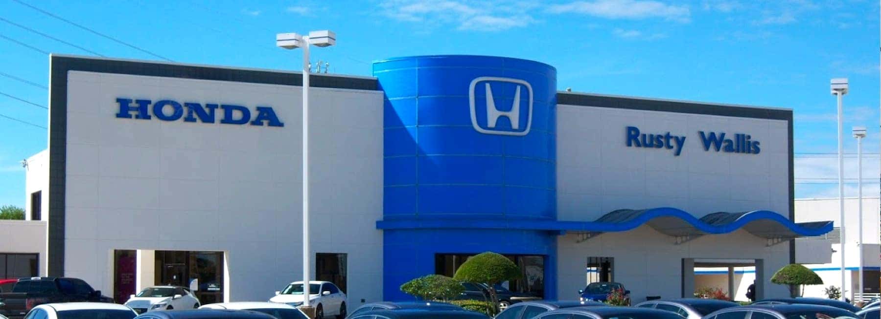 An exterior shot of a Honda dealership