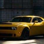 Yellow 2018 Dodge Challenger Inside a Service Garage