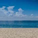 Sandy beach along oceanfront on a clear day