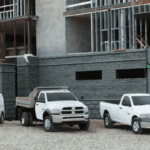 Ram work trucks parked at construction site