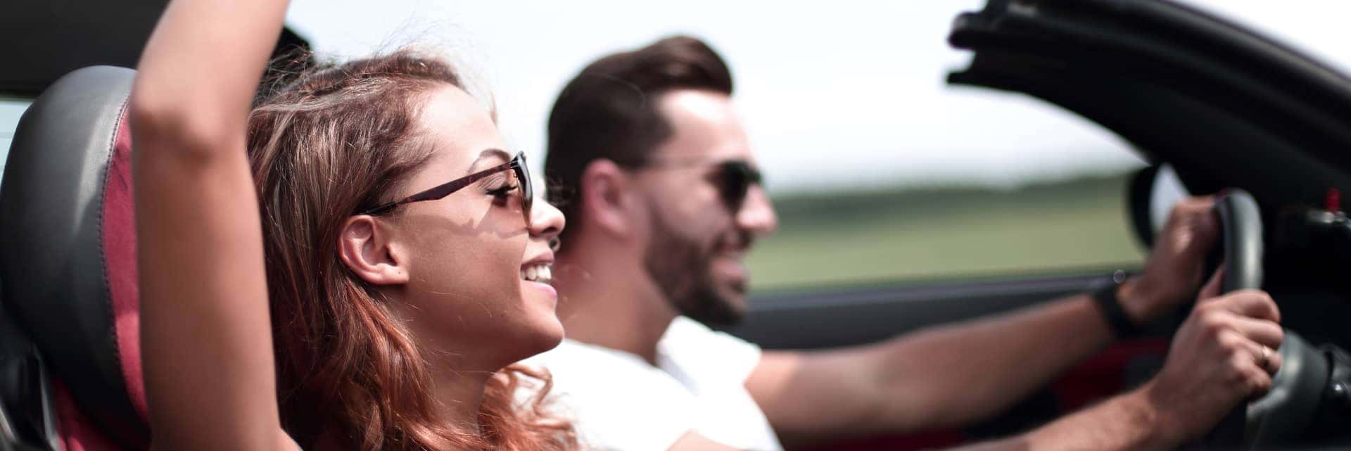 Young couple driving a car
