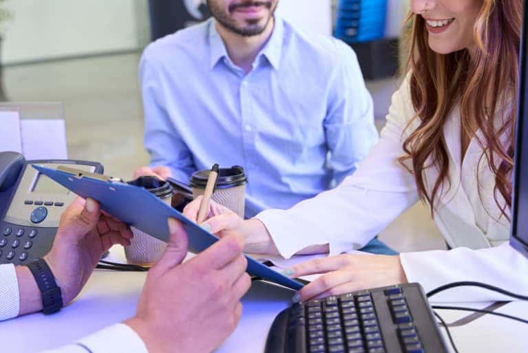 Couple Signing Papers