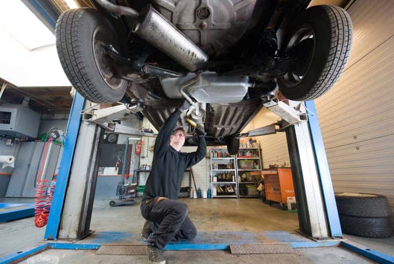 Service Technician working under a vehicle