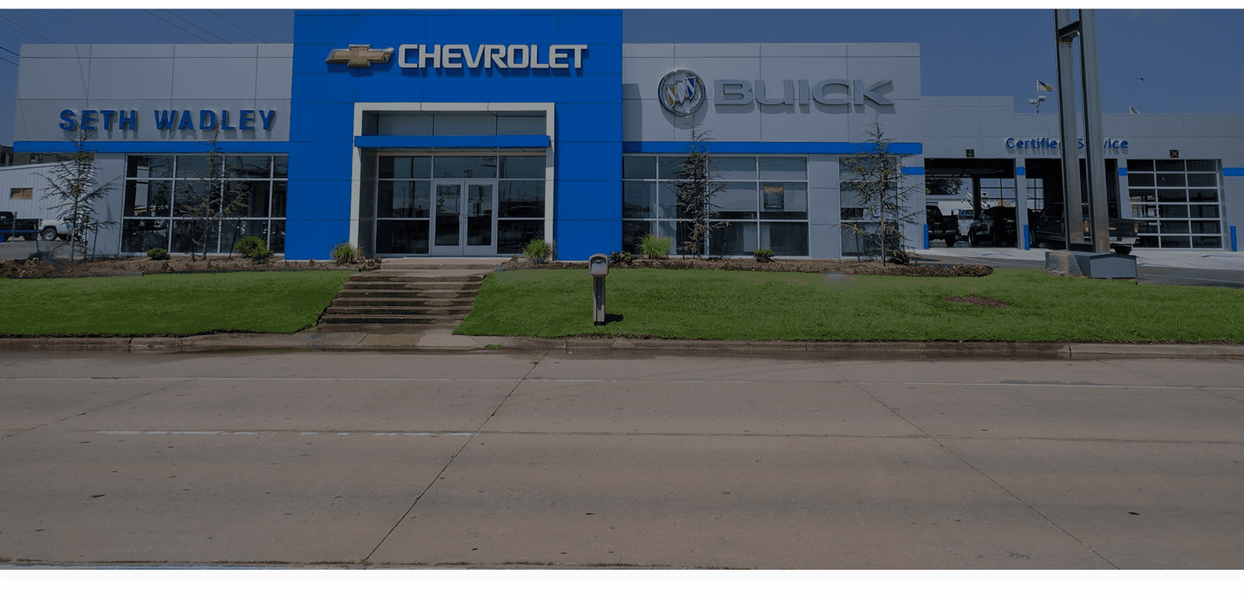 An exterior shot of the dealership entrance