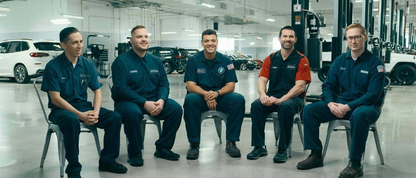 Sewell Technicians sitting and laughing in a group