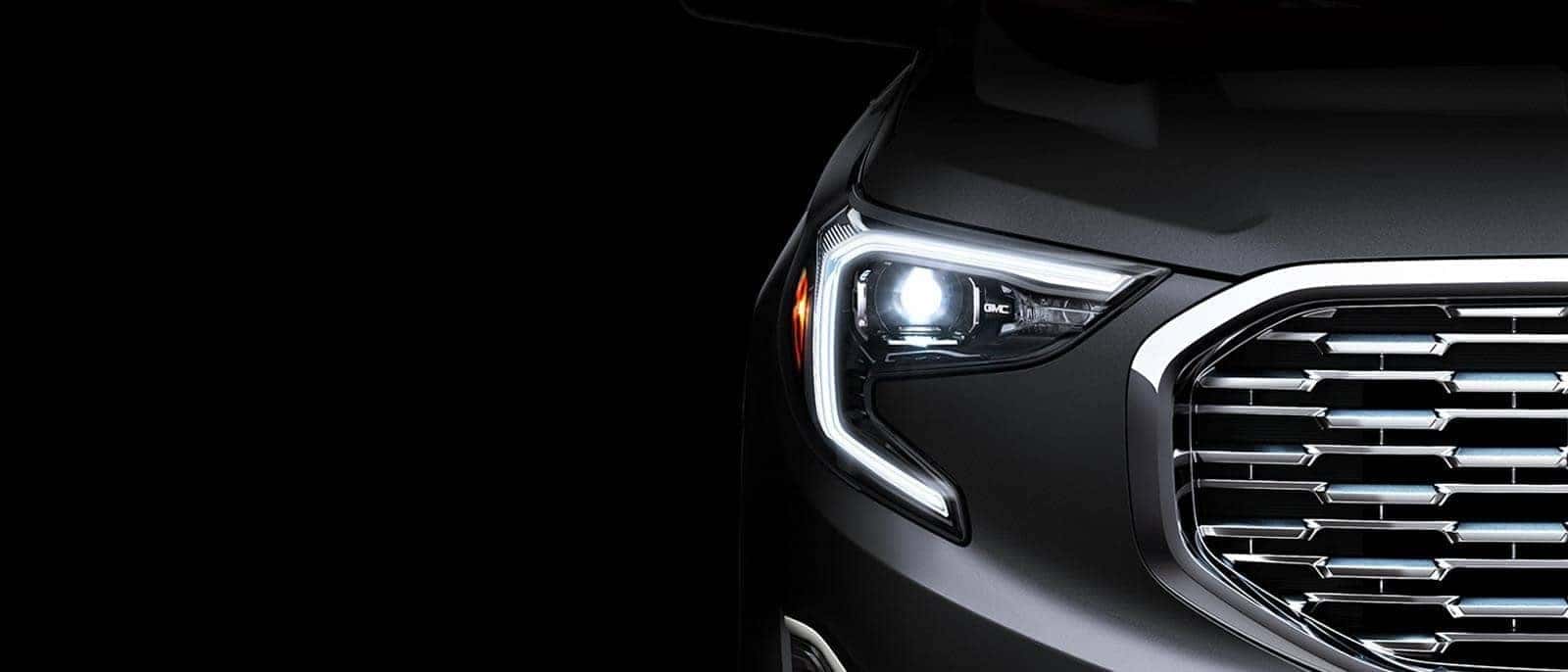 Close up Of a Vehicle Headlight and Grille