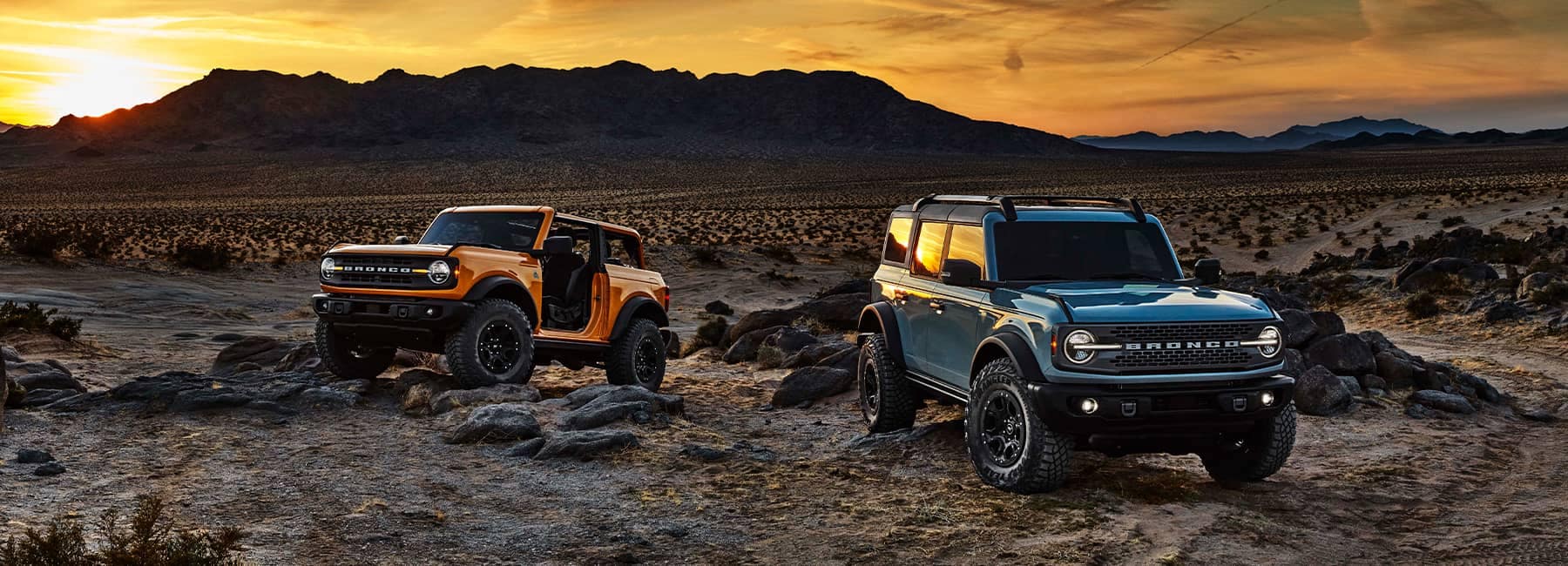 2021 Ford Broncos in the desert at sunset