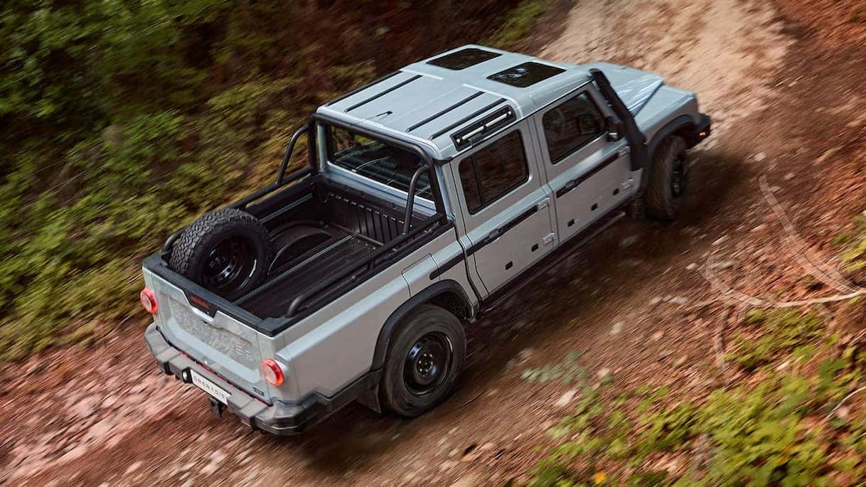Quartermaster driving off road up a hill