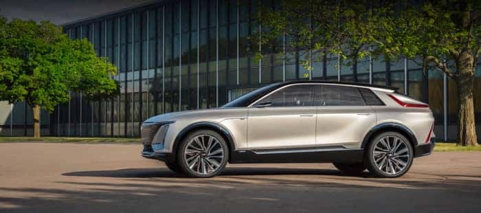 Cadillac SUV parked in front of building