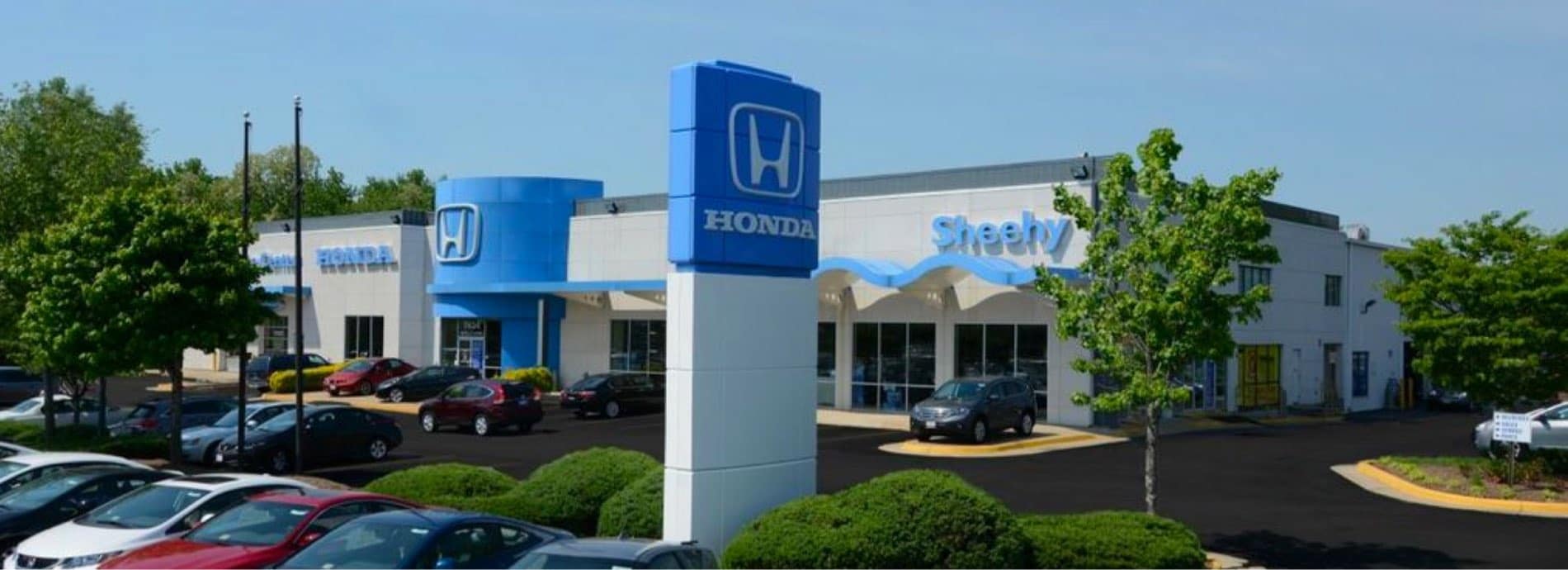 An exterior shot of a Honda dealership