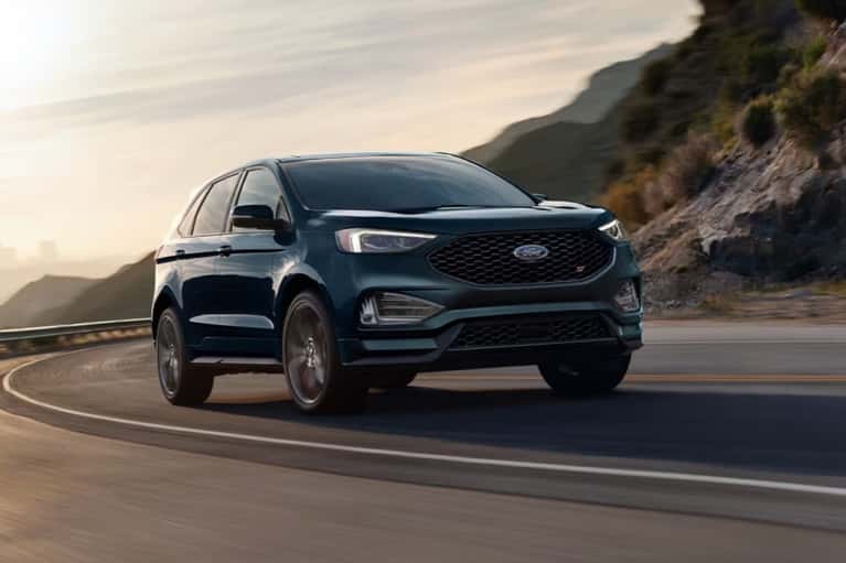 2024-Ford-Edge-speeds up winding-mountain-road