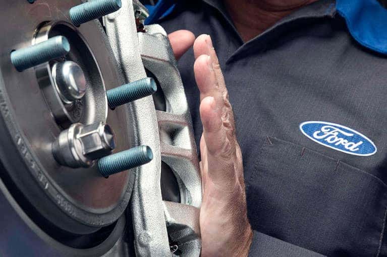 ford technician installs brakes