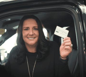 Soerens hold a Gift Card.