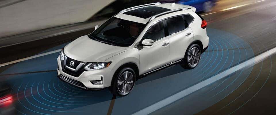 Nissan Rogue Safety A white Nissan Rogue using a safety sensing system