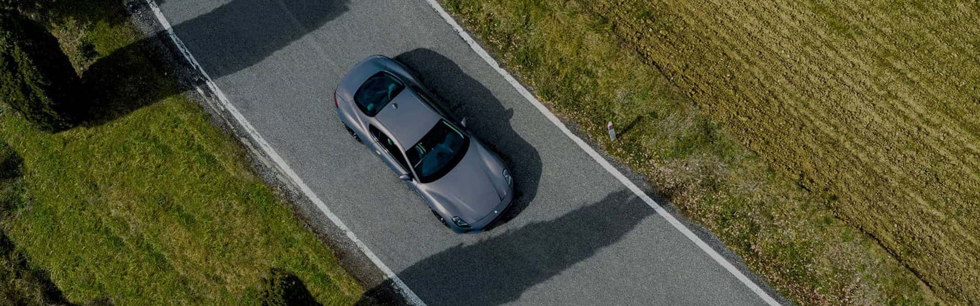 car driving down road