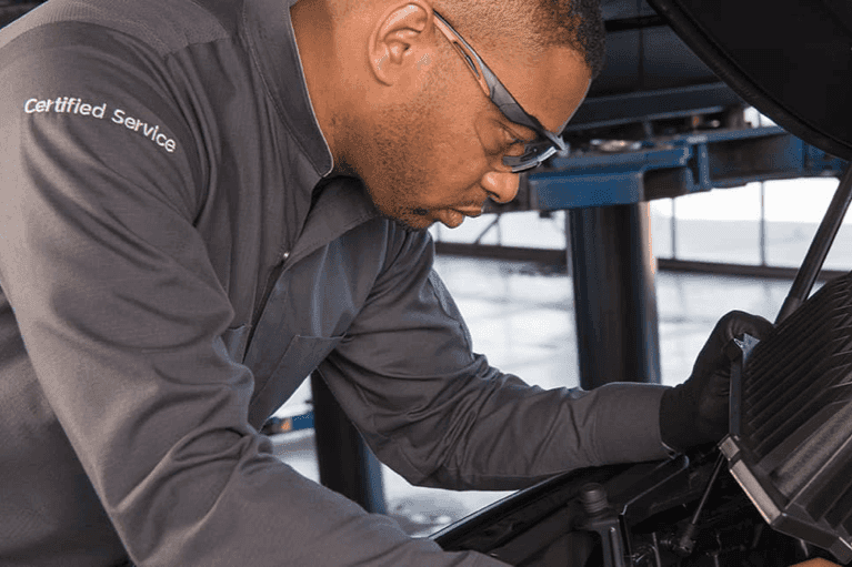 Certified-technician-inspects-car-engine