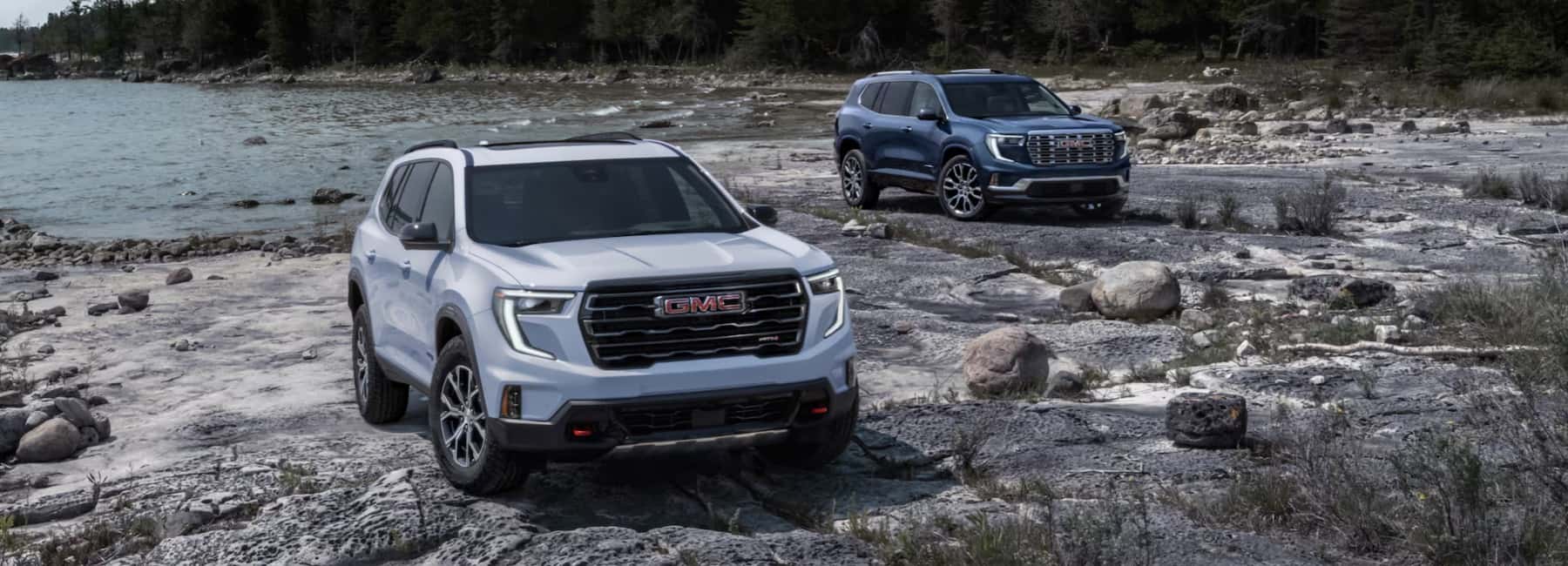 2-GMC-Acadia-parked-on-rocky-shoreline