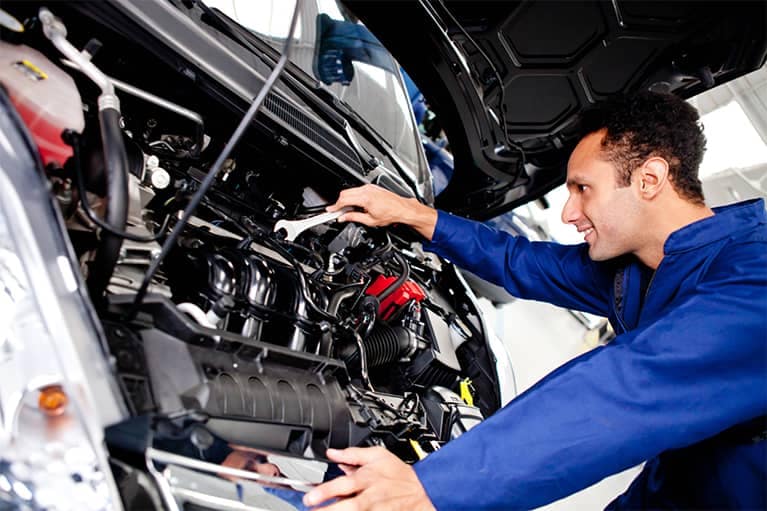 Mechanic Looking at Car Engine