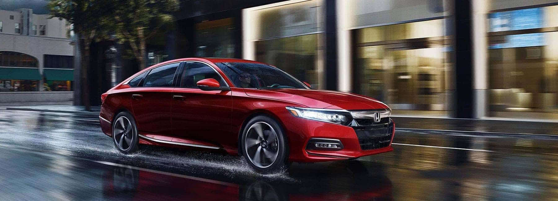 Red 2019 Honda Accord Driving on City Street at Night