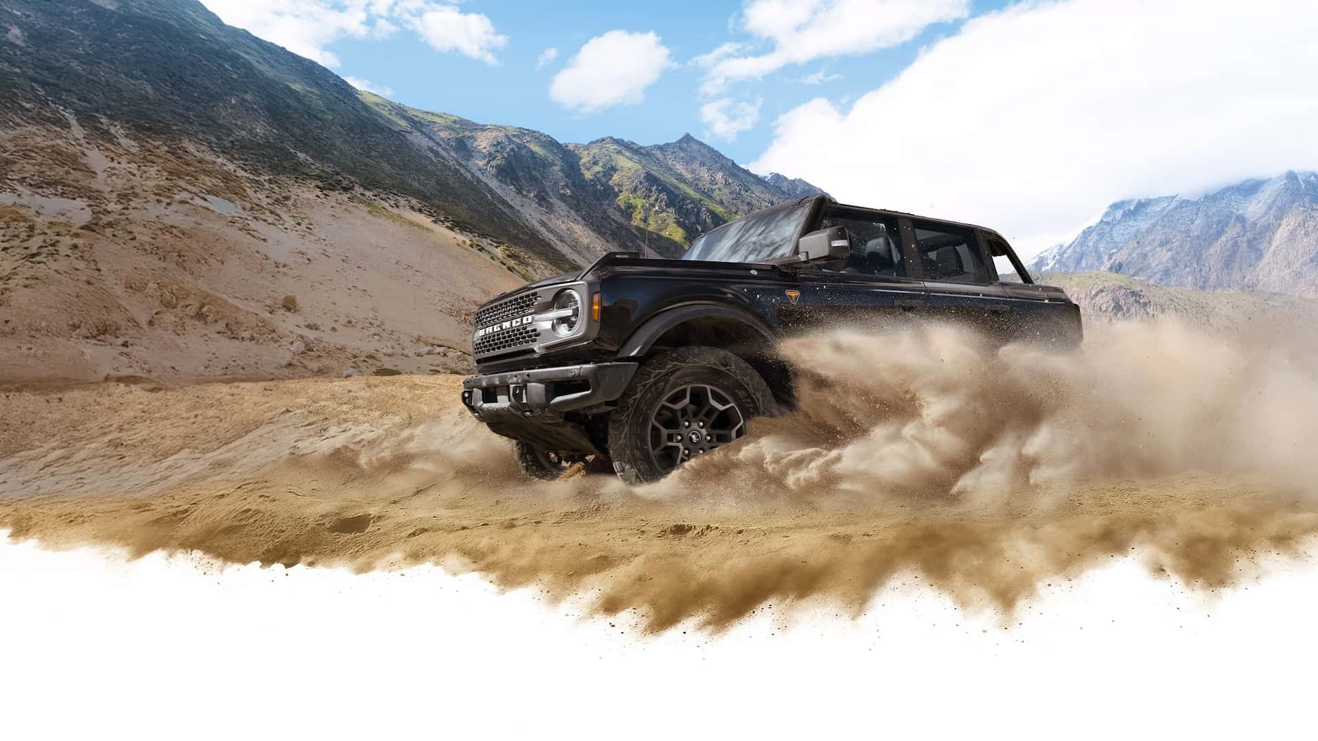 2026 Ford Bronco throwing sand in the dunes