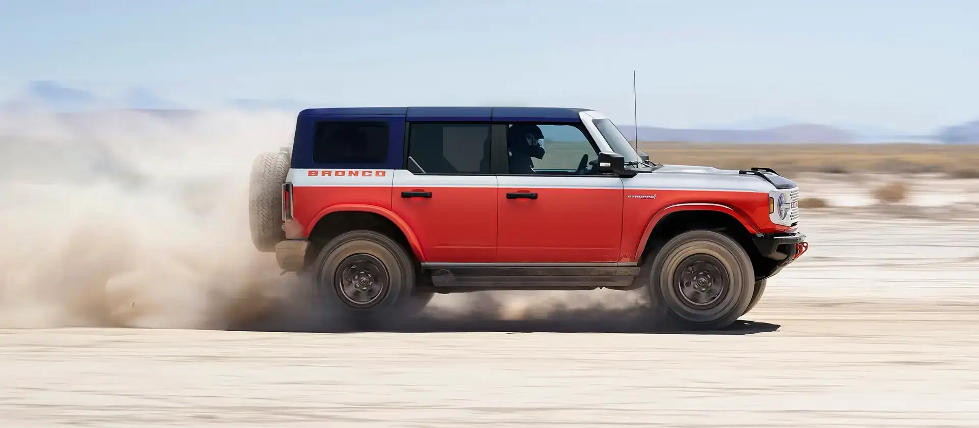 2026 Ford Bronco Stroppe driving over the desert sands