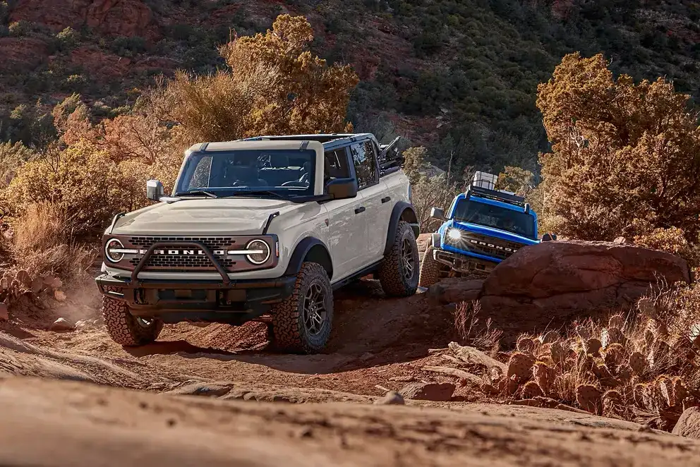 2026 Ford Broncos traversing over rocks hills and dirt roads