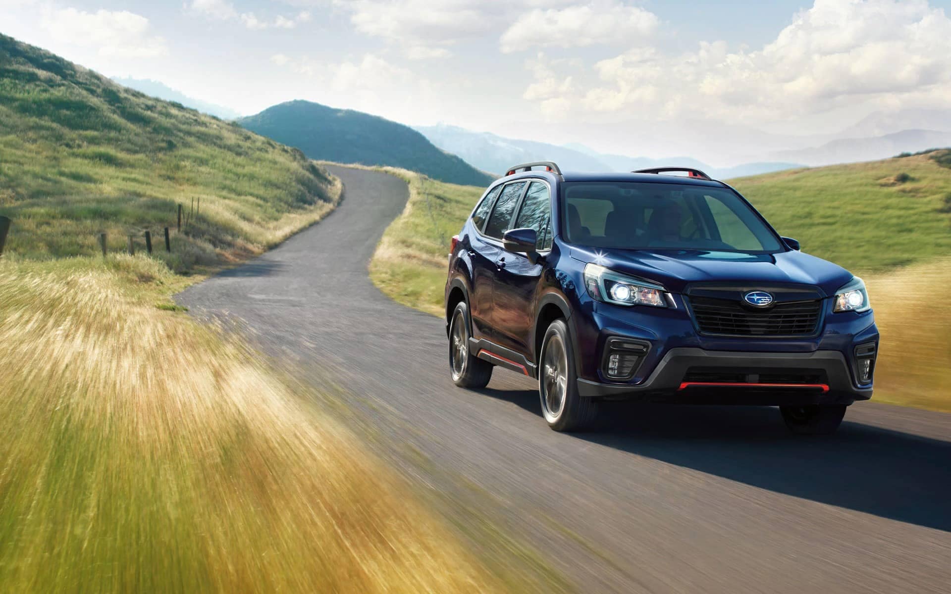 2021 Forester driving down a road