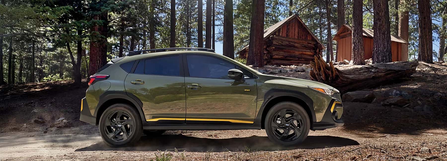 2025-Subaru-Cross-trek-parked-by-cabins-in-the-woods