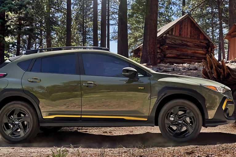 2025-Subaru-Cross-trek-parked-by-cabins-in-the-woods-mobile