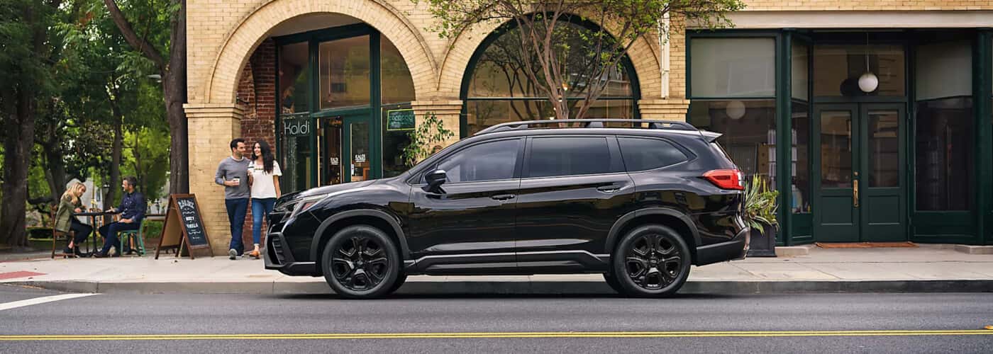 2024-Subaru-Ascent-parked-in-front-of-a-downtown-cafe
