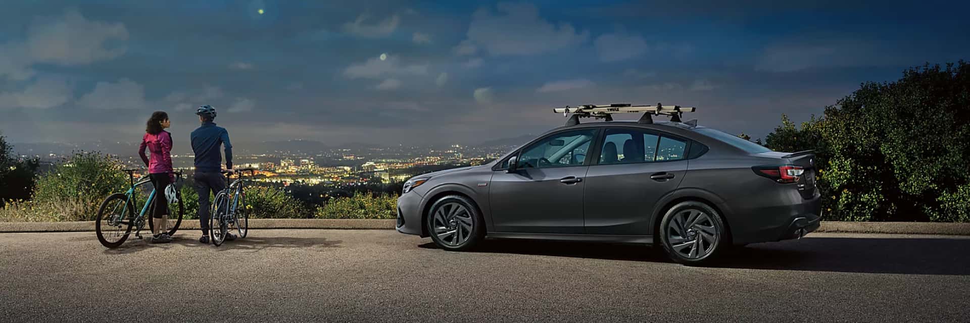 2024-Subaru-Legacy-parked-by-a-bluff-overlooking-the-city-below