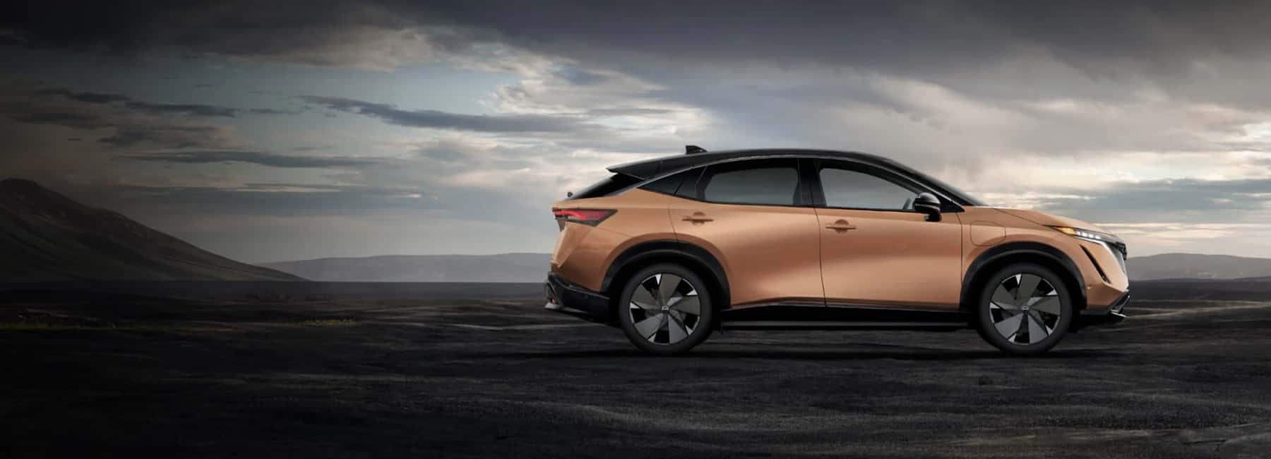 2025-nissan-ariya-ev-parked-on-dirt
