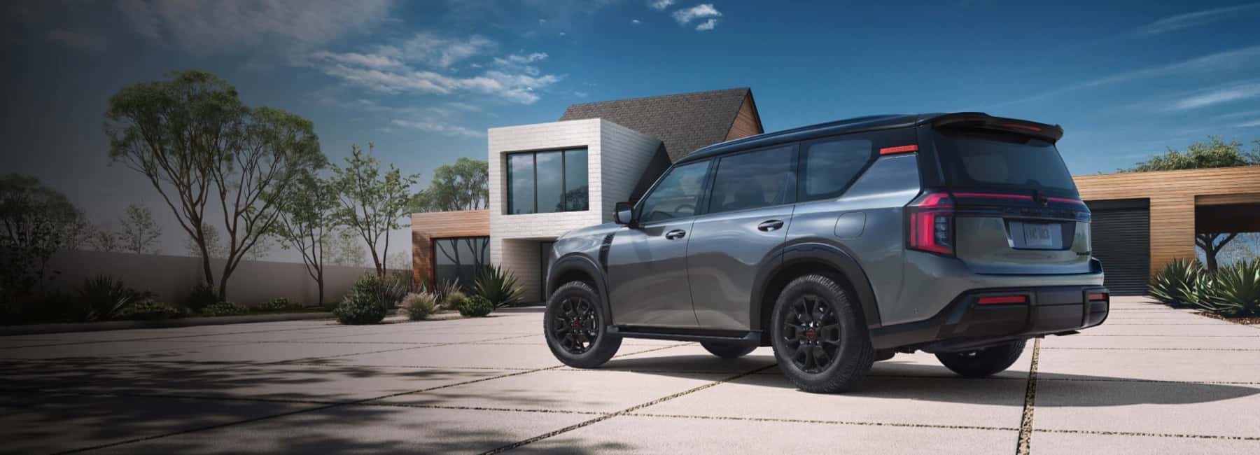 2025-nissan-armada-parked-modern-house
