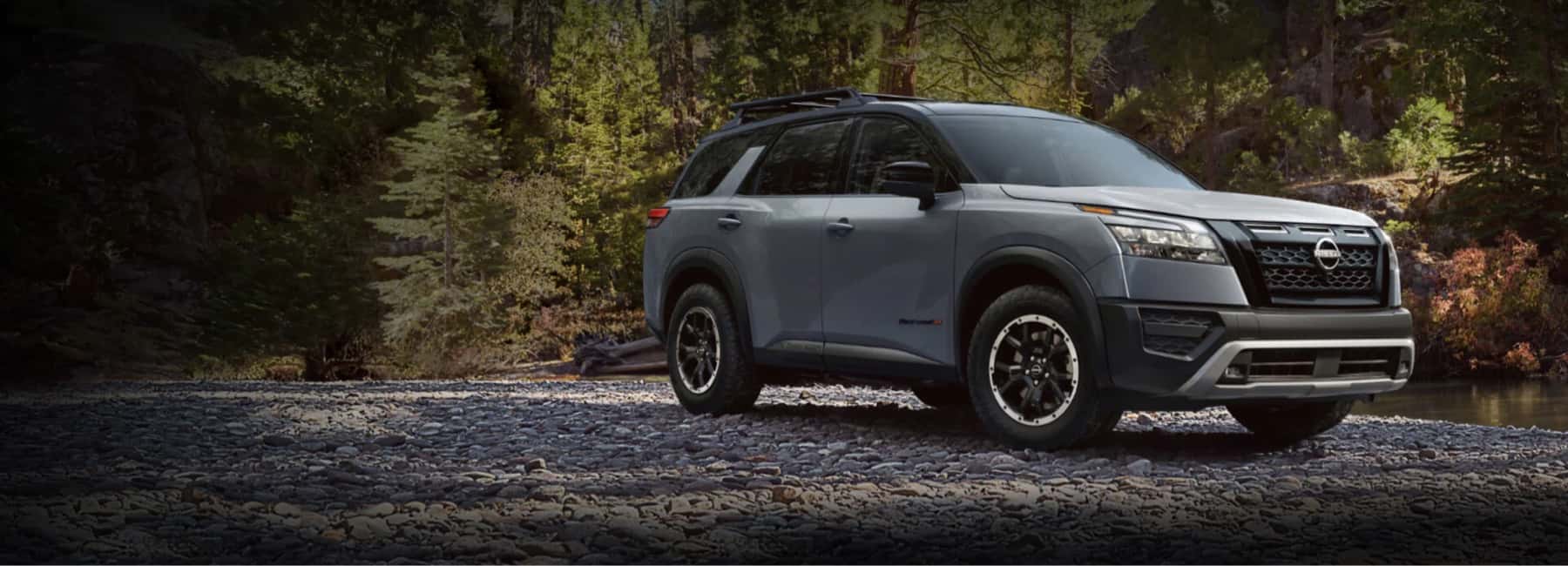 2025 nissan pathfinder parked on riverbed pebbles-desktop