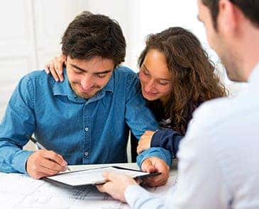 Couple filling out finance paperwork