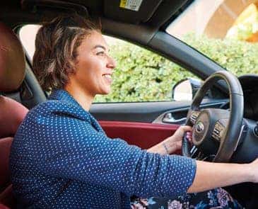 Woman starting a car