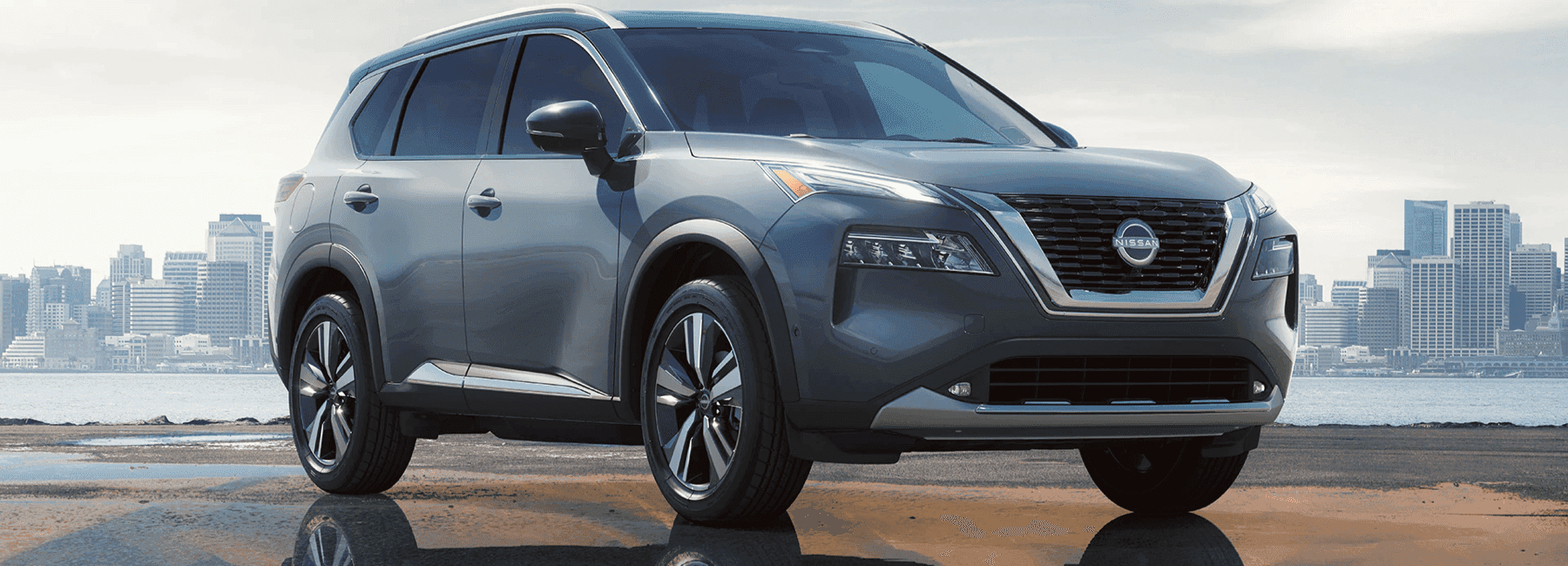 2023-Nissan-rouge-cityscape-over-water-desktop