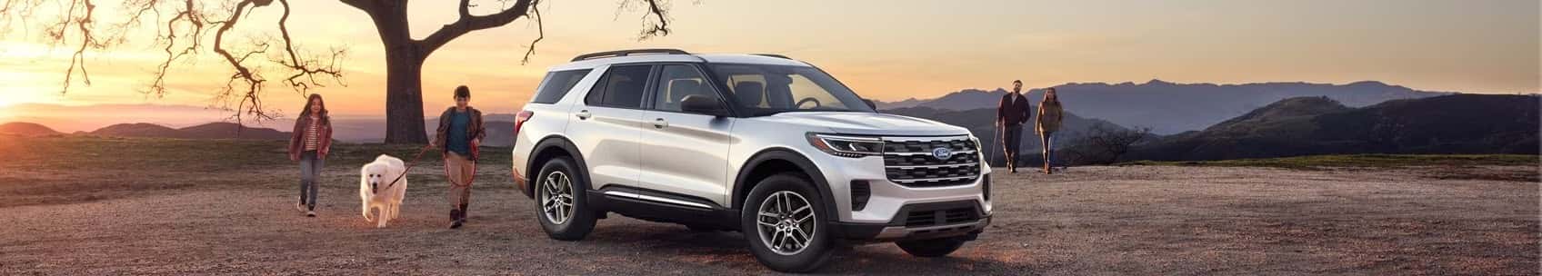Freinds walking away from parked Ford Explorer
