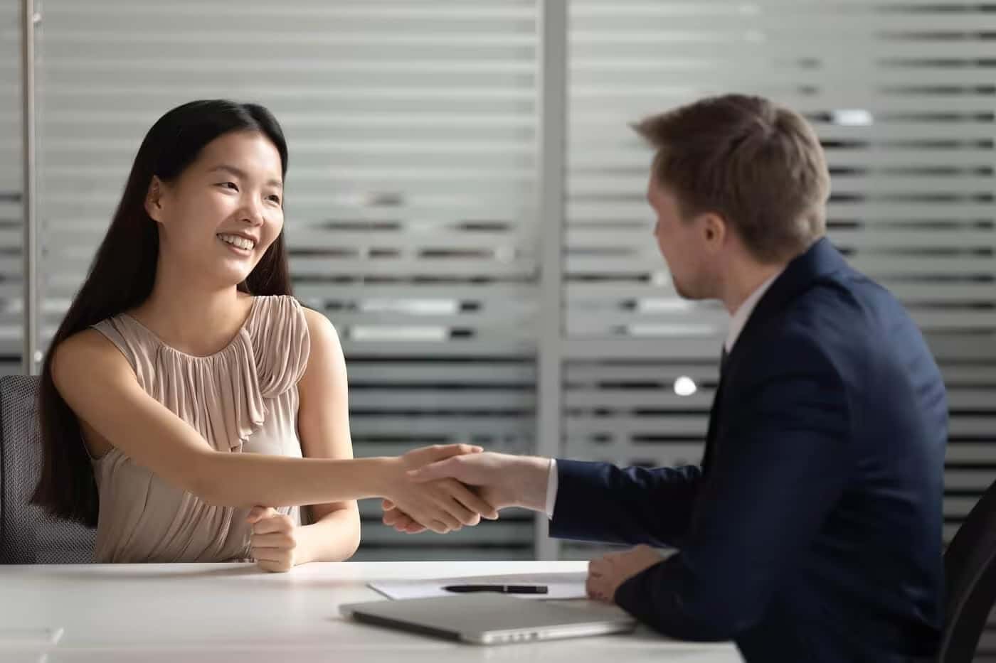 sales manager and customer shaking hands