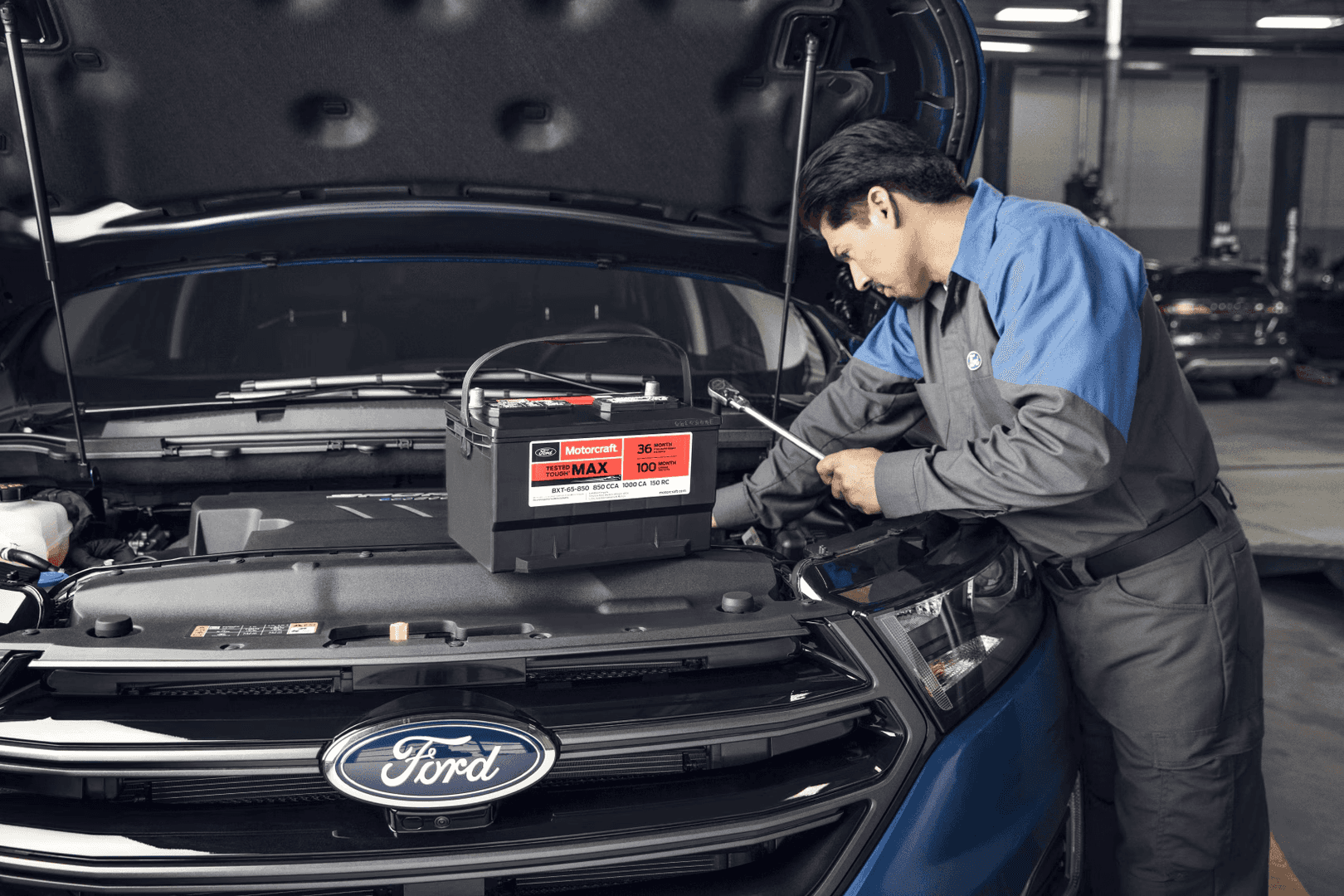 Ford service tech performing battery replacement