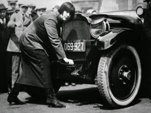 lady in the 1920 driving a car 