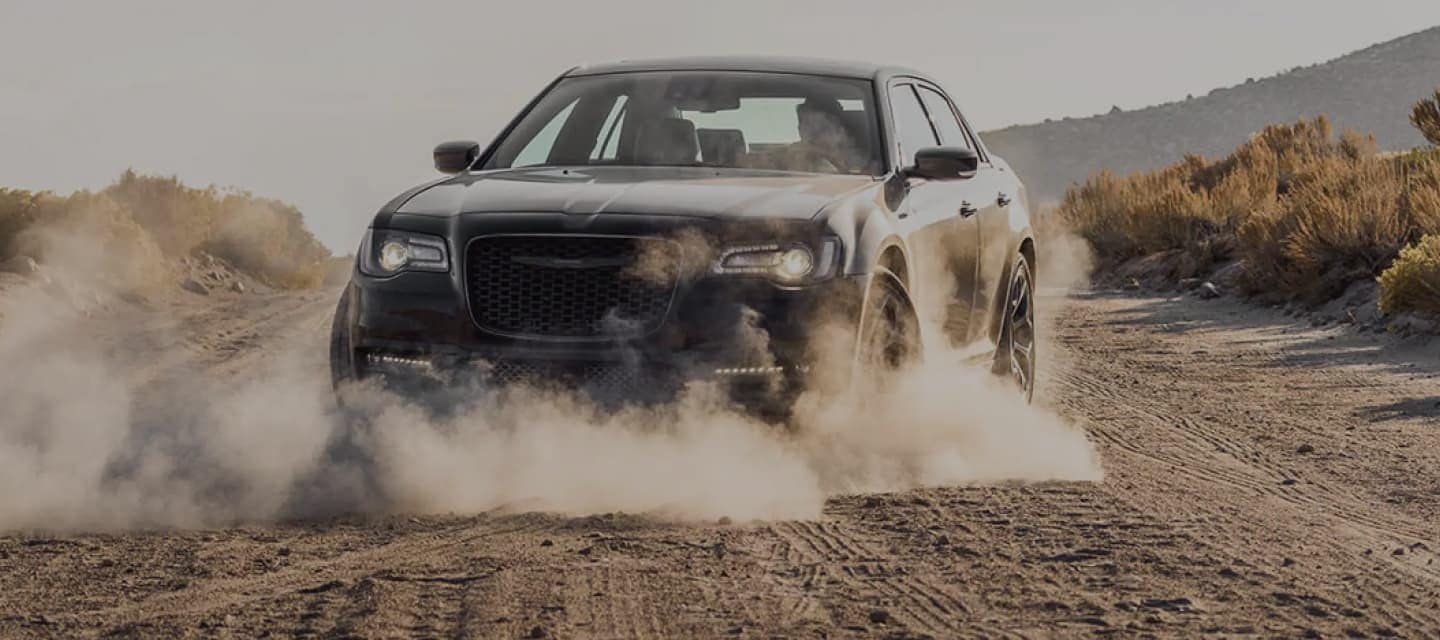Chrysler vehicle skidding on dusty road